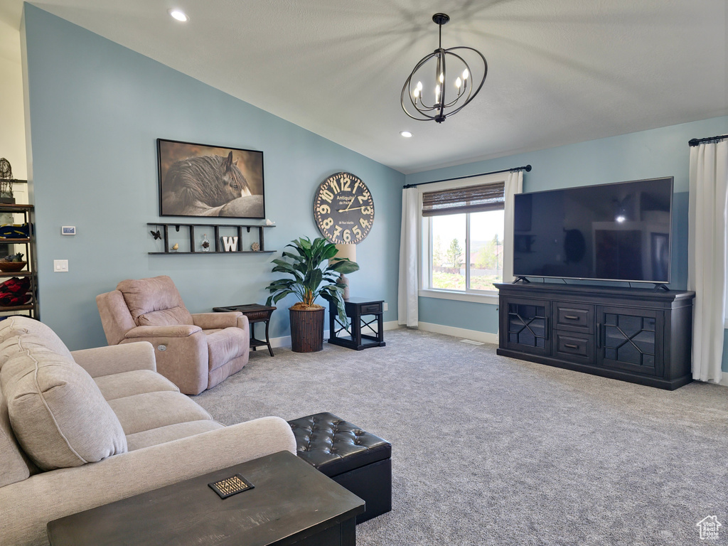 Carpeted living room with a chandelier, vaulted ceiling, recessed lighting, and baseboards
