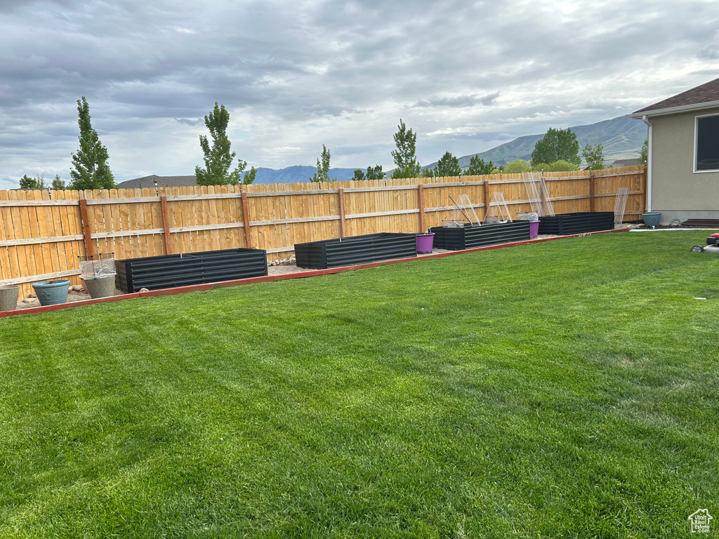 View of yard with a mountain view