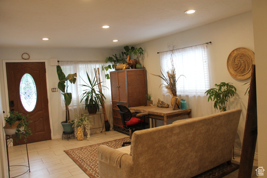 Living area featuring plenty of natural light and recessed lighting