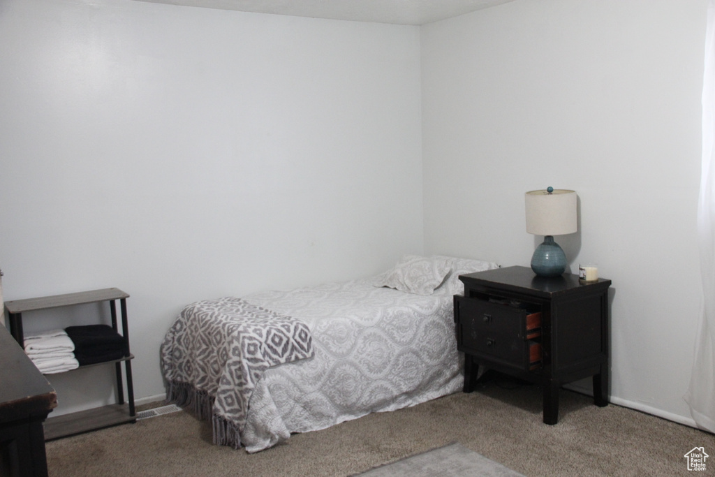 Bedroom with carpet flooring