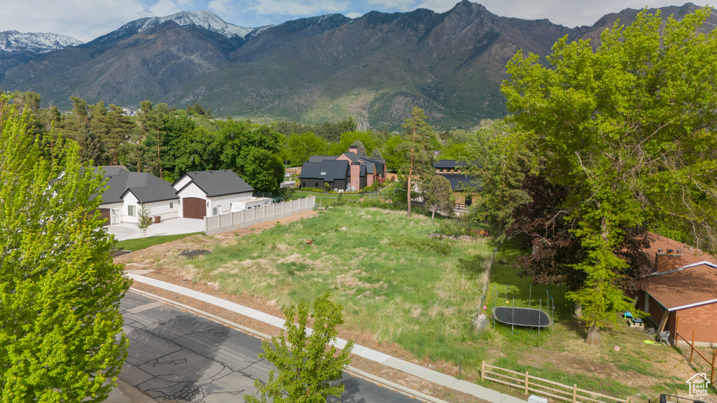 Aerial view of residential area featuring a mountainous background