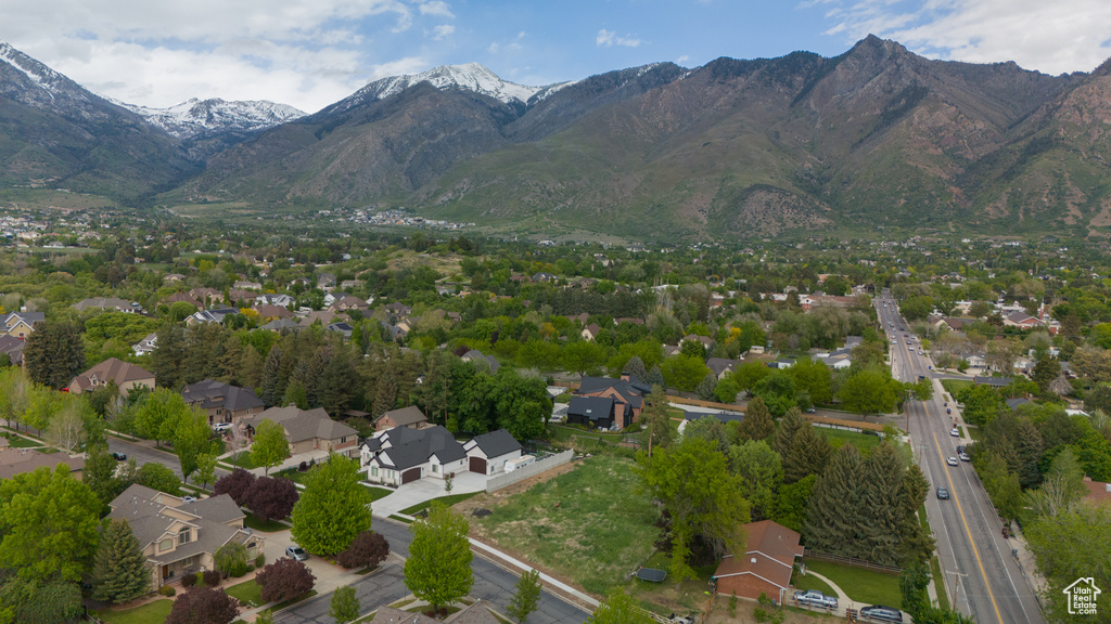 View of property location featuring a mountainous background and nearby suburban area