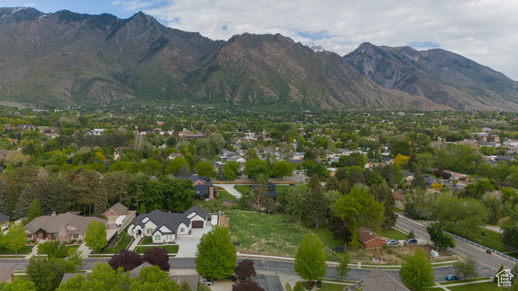 Aerial view of residential area featuring mountains
