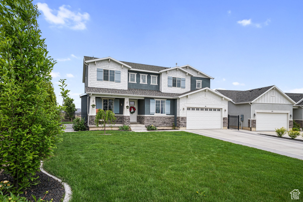 Craftsman house featuring a porch, stone siding, driveway, an attached garage, and a shingled roof