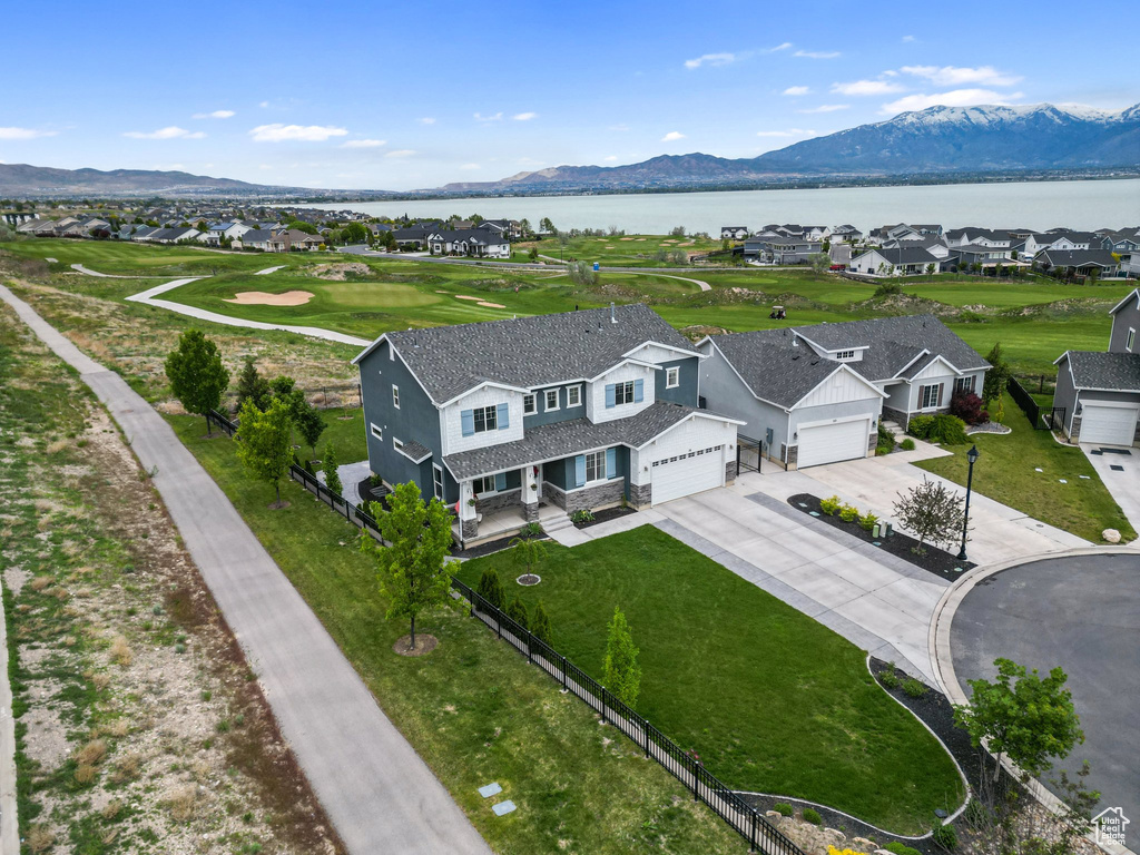 Aerial perspective of suburban area featuring a water and mountain view