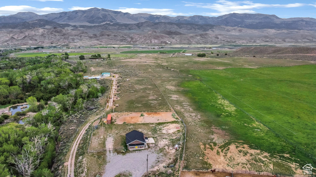 Aerial view of property\'s location featuring rural landscape and a mountain backdrop