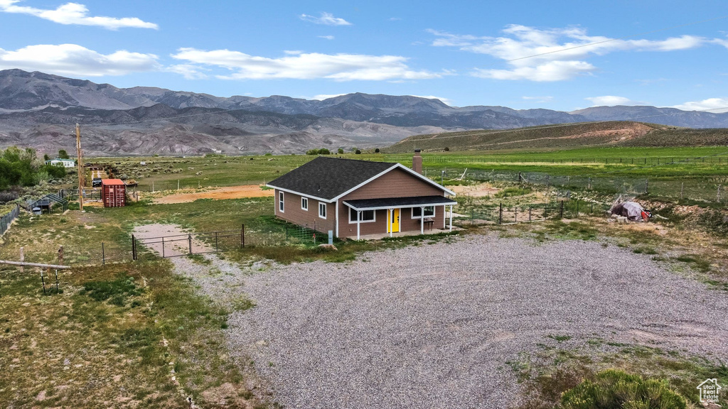View of mountain backdrop with rural landscape