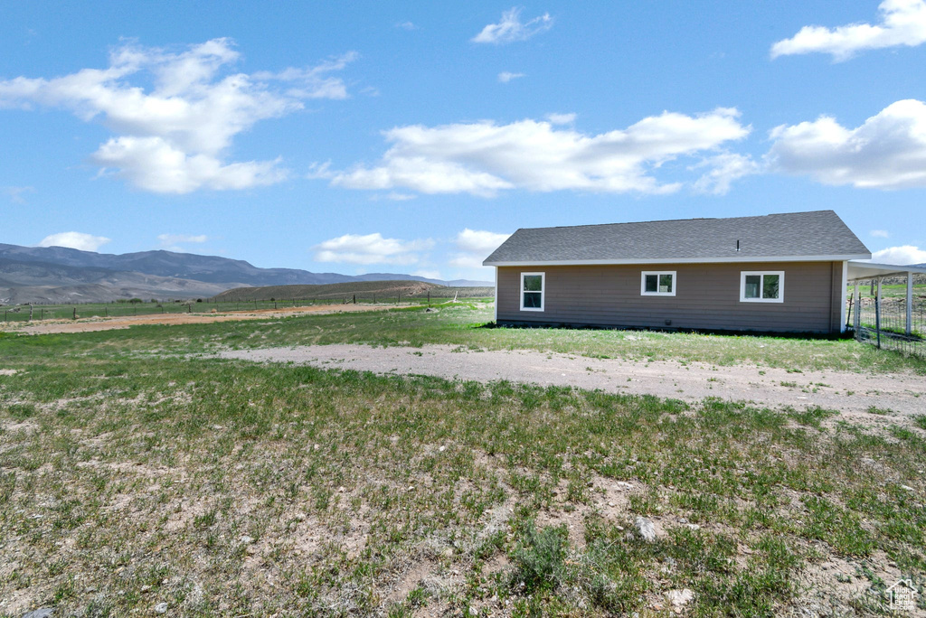 View of home\\\\\\\\\\\\\\\'s exterior featuring a mountain view and fence