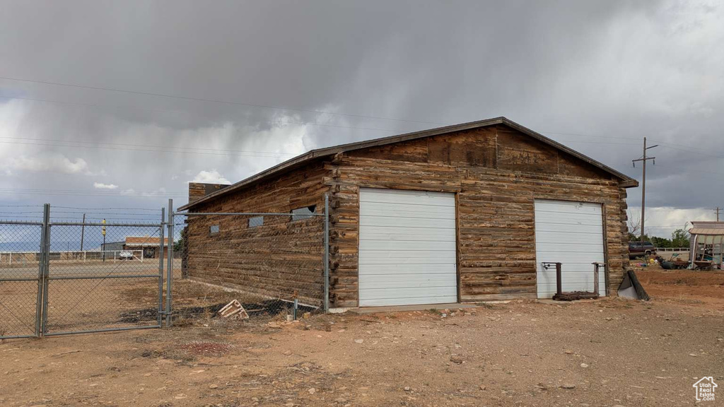 Garage featuring fence