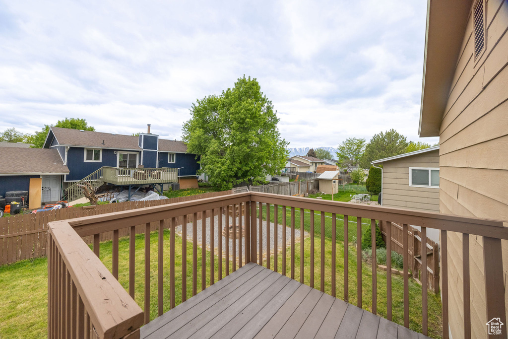 Wooden deck featuring a residential view