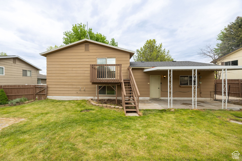 Back of property with a patio area and stairway