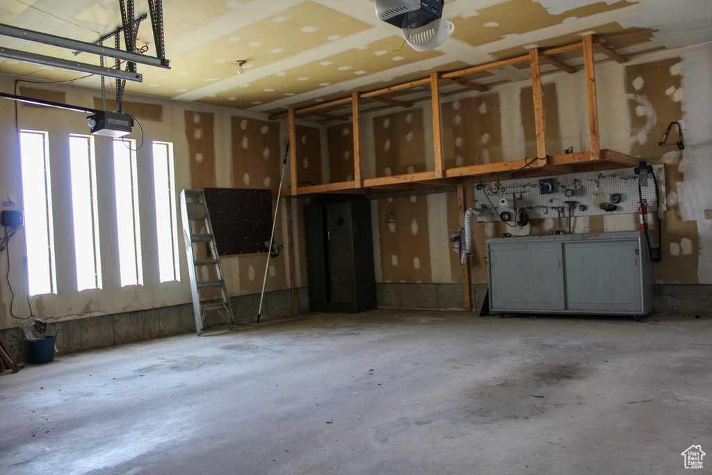 Garage featuring a garage door opener