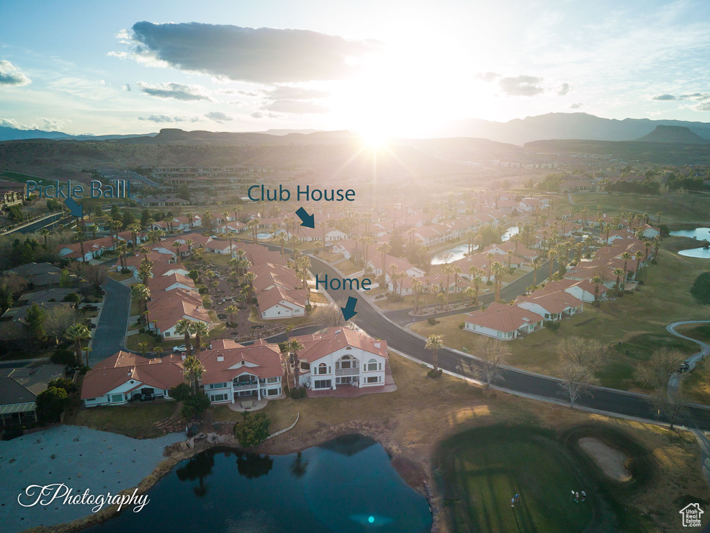 Aerial perspective of suburban area featuring a water and mountain view
