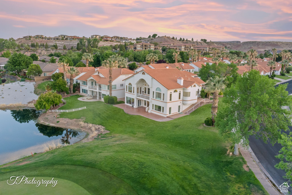 Aerial view at dusk of a residential view and a water view