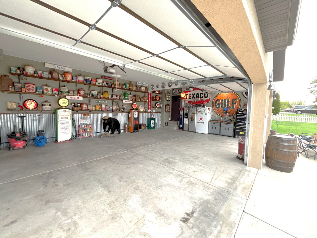 Garage featuring freestanding refrigerator