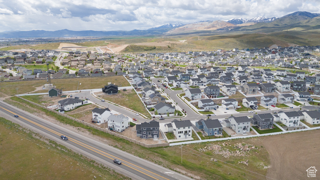 Aerial view of residential area featuring mountains