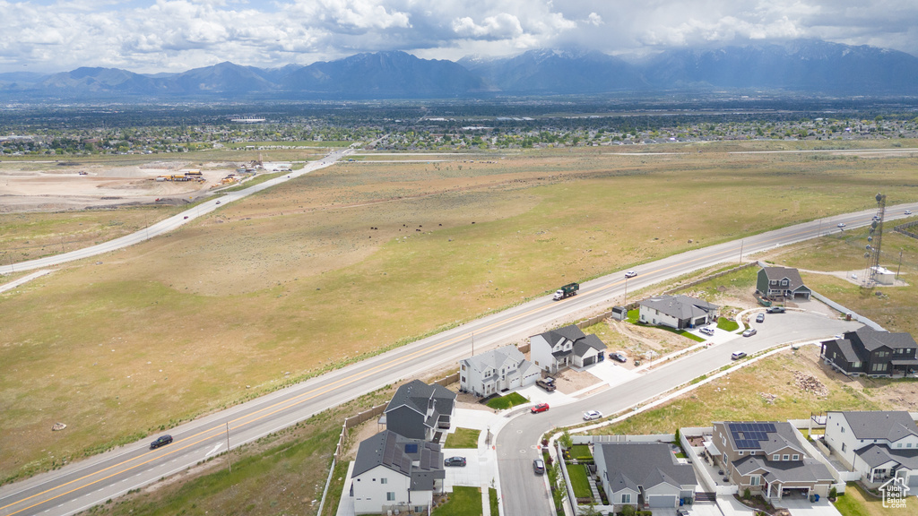 Aerial perspective of suburban area with a mountainous background