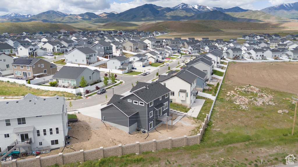 Aerial perspective of suburban area with a mountainous background