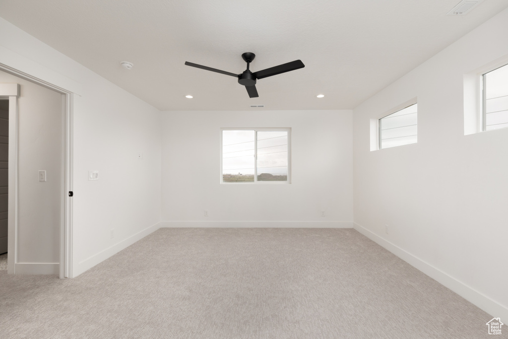Empty room with ceiling fan, carpet, baseboards, recessed lighting, and a smoke detector