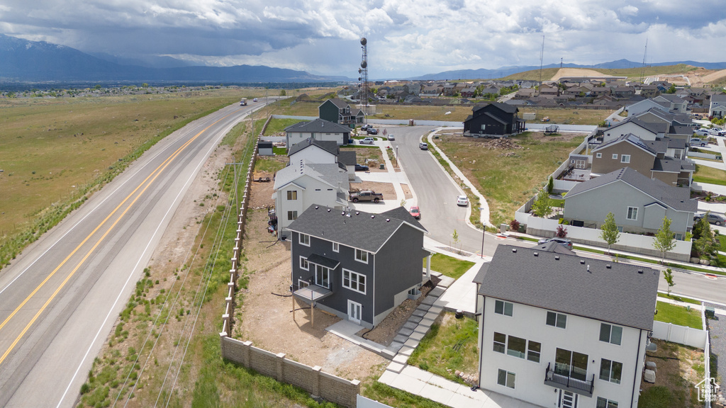 Aerial perspective of suburban area featuring a mountainous background