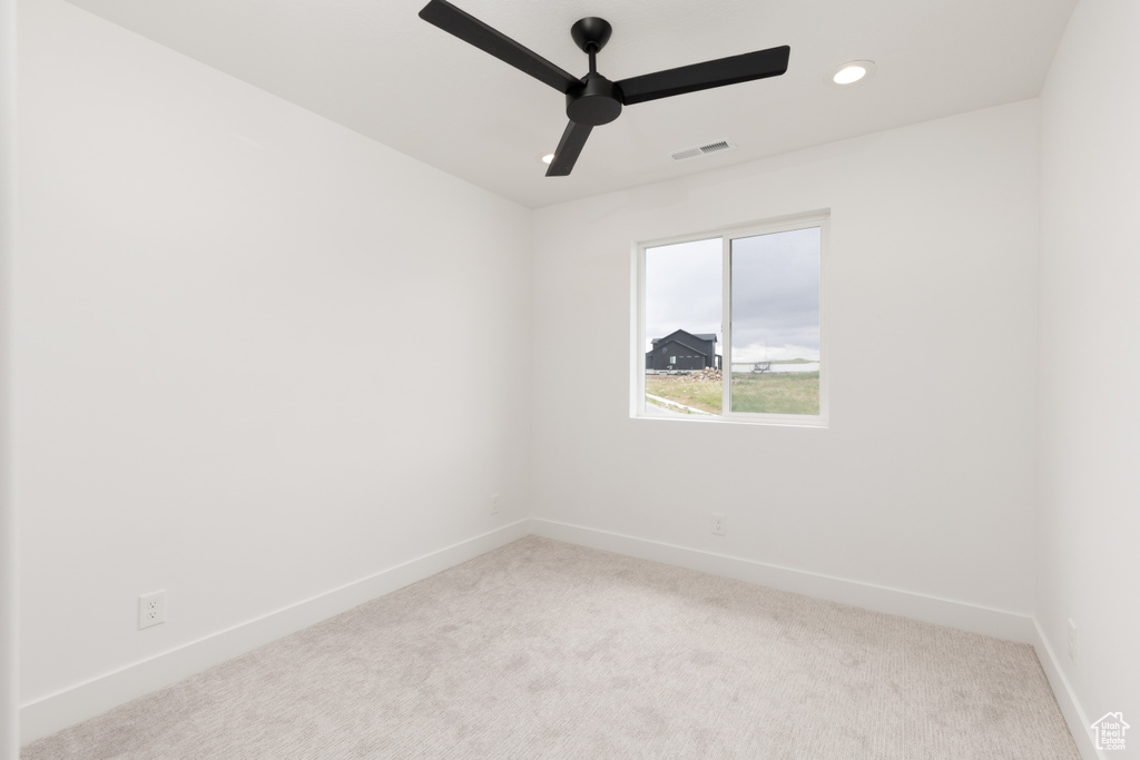 Unfurnished room featuring carpet floors, baseboards, recessed lighting, and ceiling fan