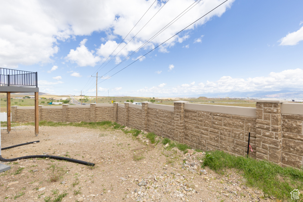 View of yard featuring fence