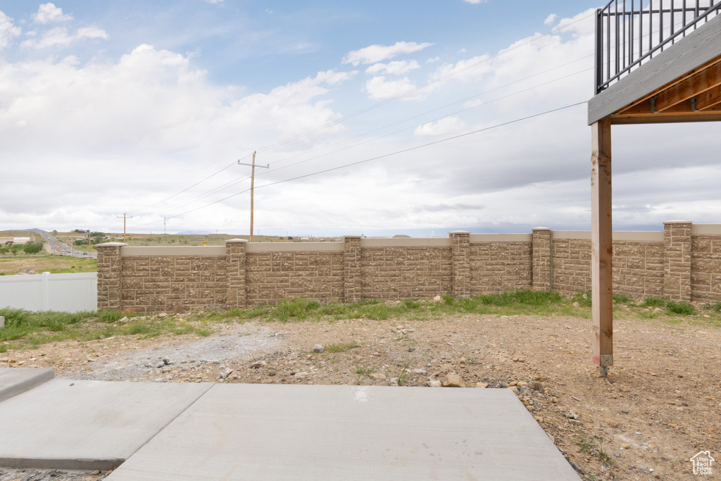 View of fenced backyard