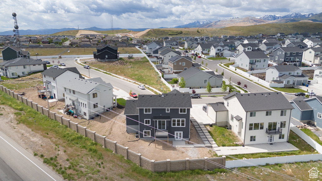 Aerial perspective of suburban area with a mountain backdrop