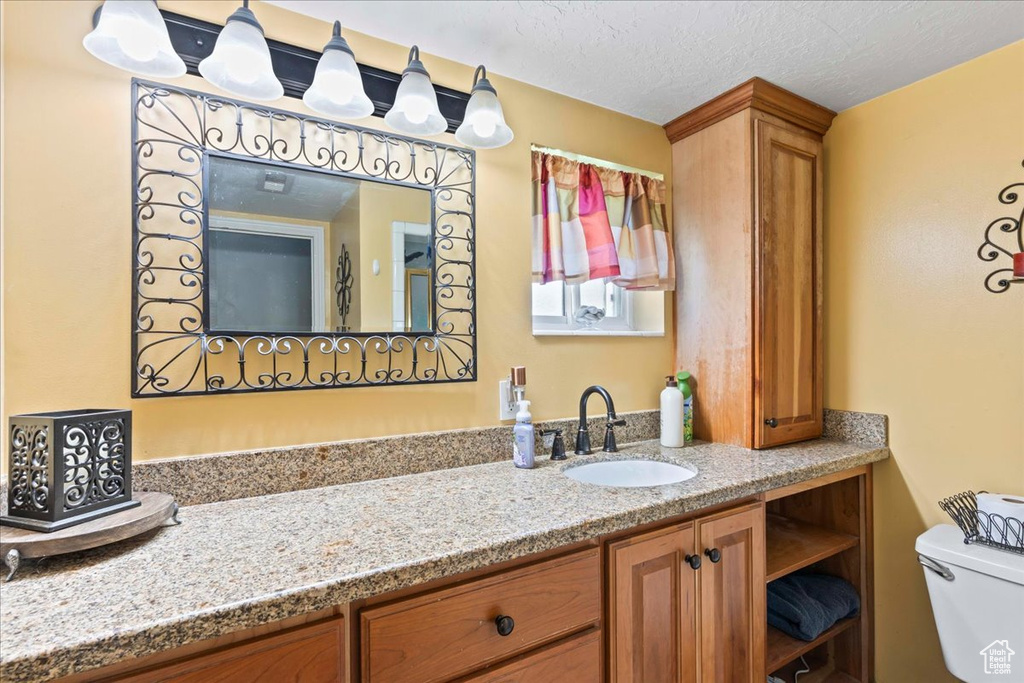 Bathroom featuring toilet and vanity