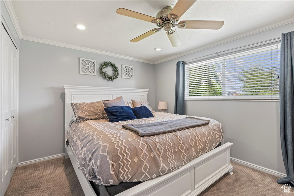 Bedroom featuring carpet, baseboards, a closet, ornamental molding, and recessed lighting