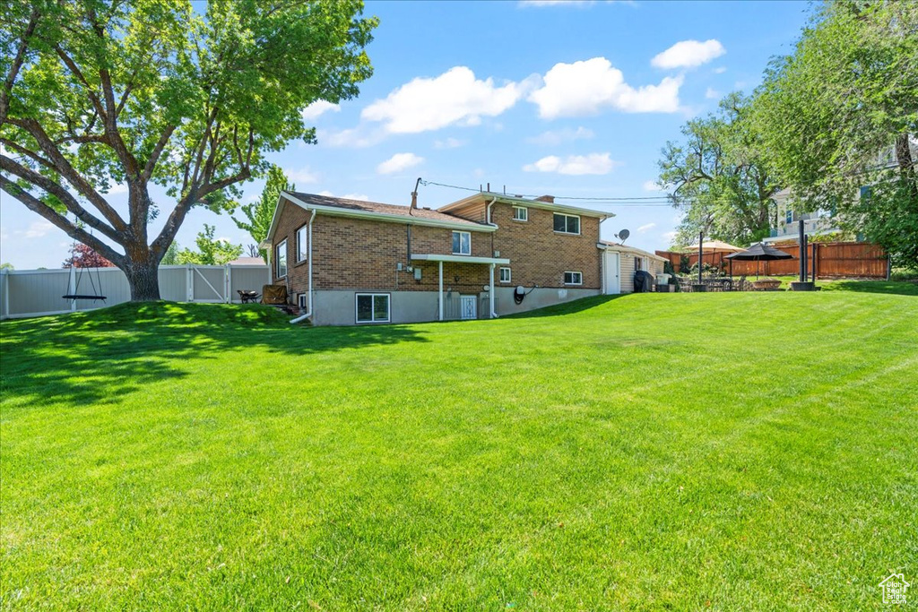 Rear view of house with brick siding