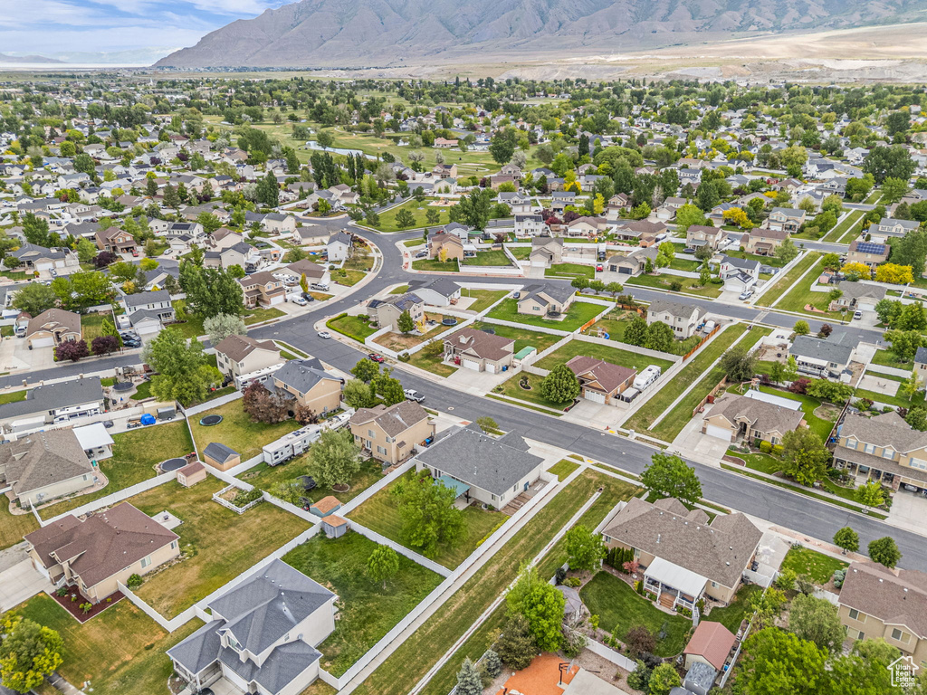 Aerial perspective of suburban area with a mountain backdrop