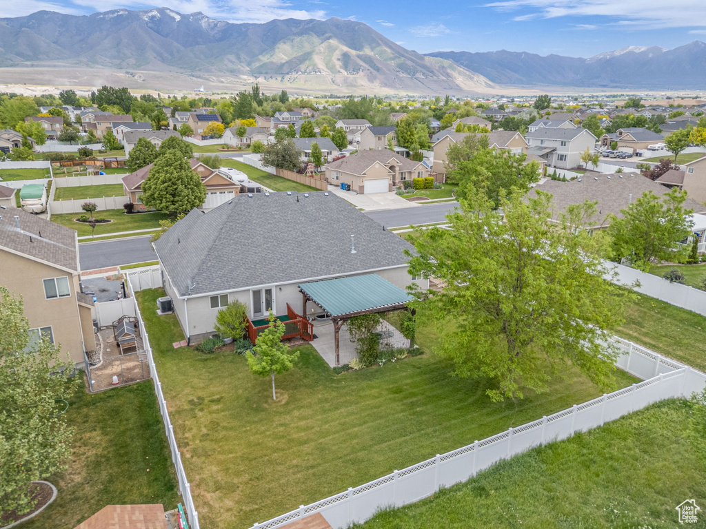 Aerial perspective of suburban area with a mountainous background