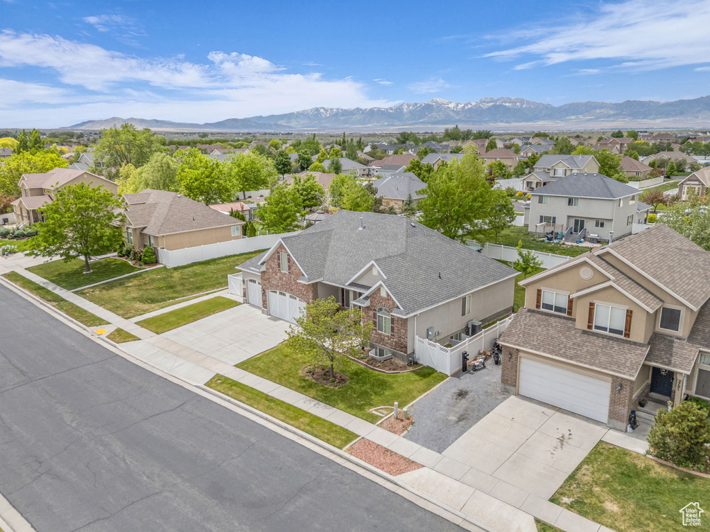 Aerial view of residential area with a mountainous background