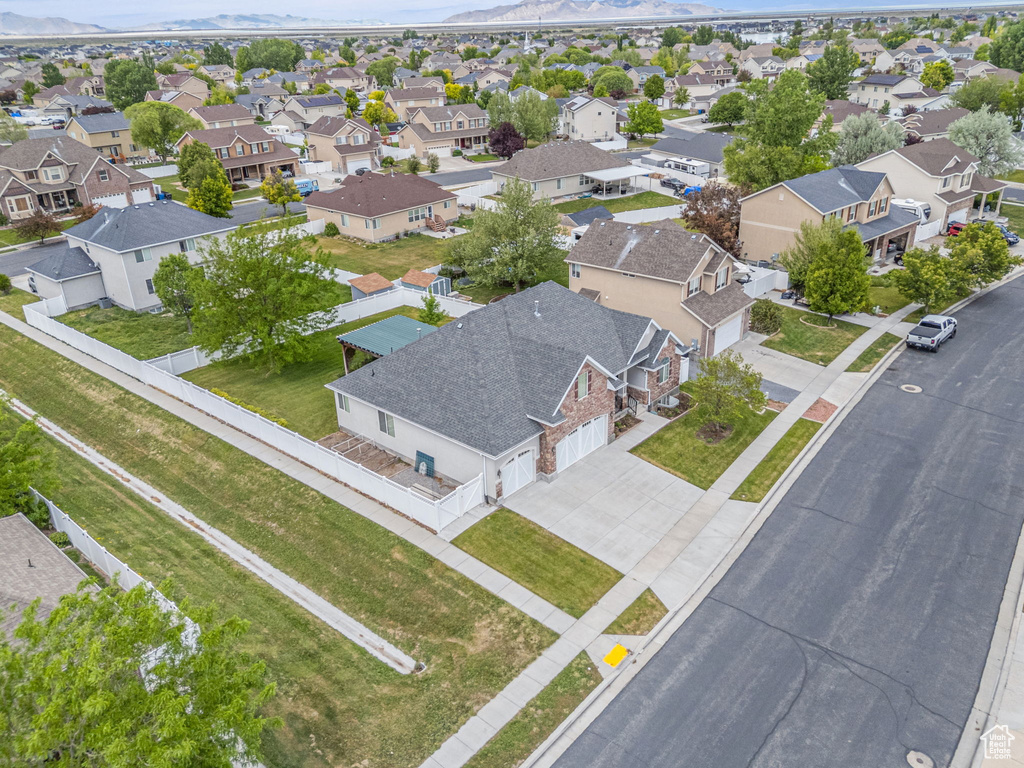 Aerial perspective of suburban area featuring a mountain backdrop