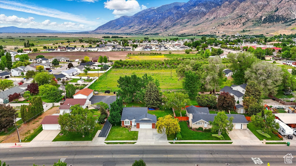 Aerial view of residential area featuring a mountainous background