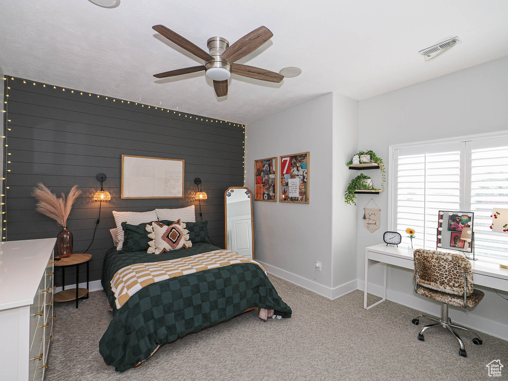 Bedroom featuring baseboards, a desk, carpet flooring, and a ceiling fan