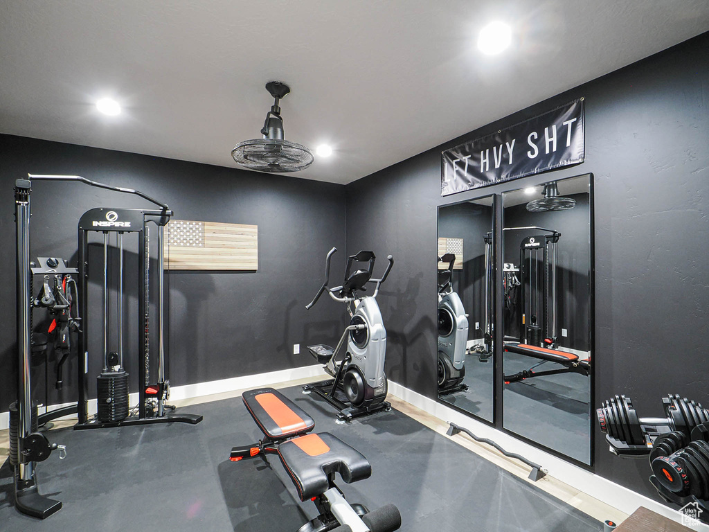 Exercise area with recessed lighting and baseboards