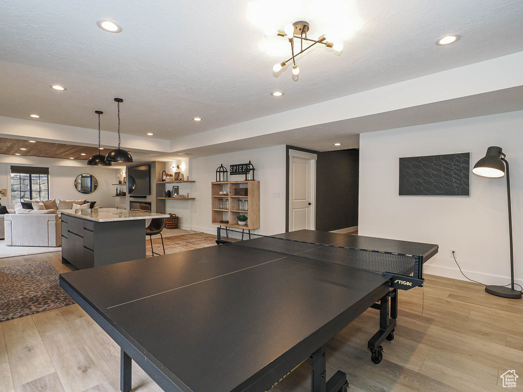 Rec room featuring light wood-style floors, recessed lighting, and baseboards