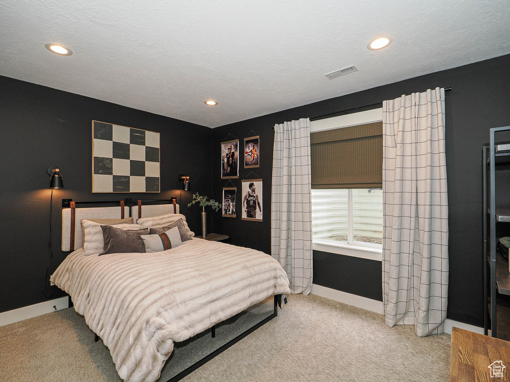 Carpeted bedroom featuring baseboards and recessed lighting