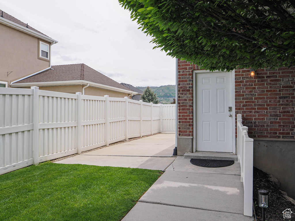 View of yard featuring a patio area and a mountain view