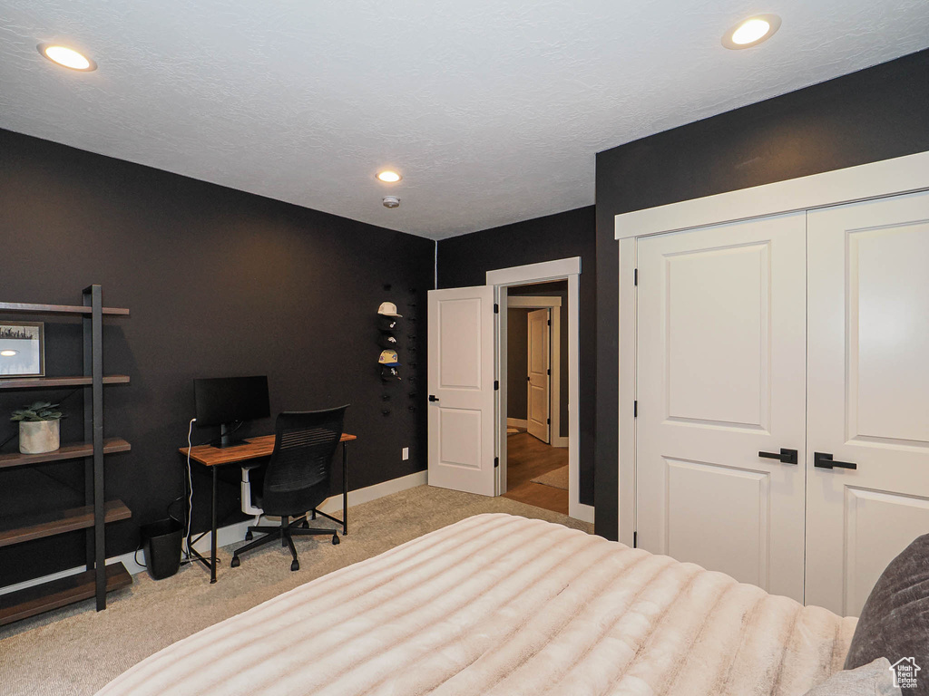 Bedroom with carpet, recessed lighting, a closet, and baseboards