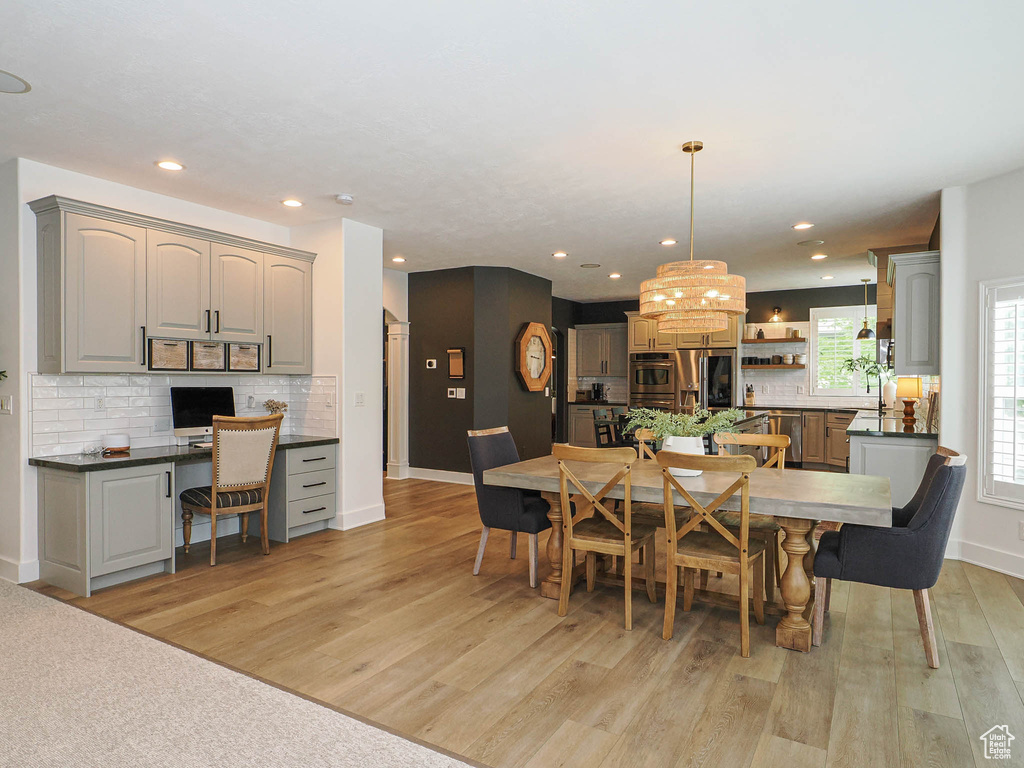 Dining area featuring light wood-type flooring, recessed lighting, and baseboards