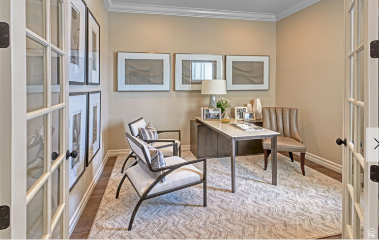 Office space featuring french doors, wood finished floors, baseboards, and ornamental molding