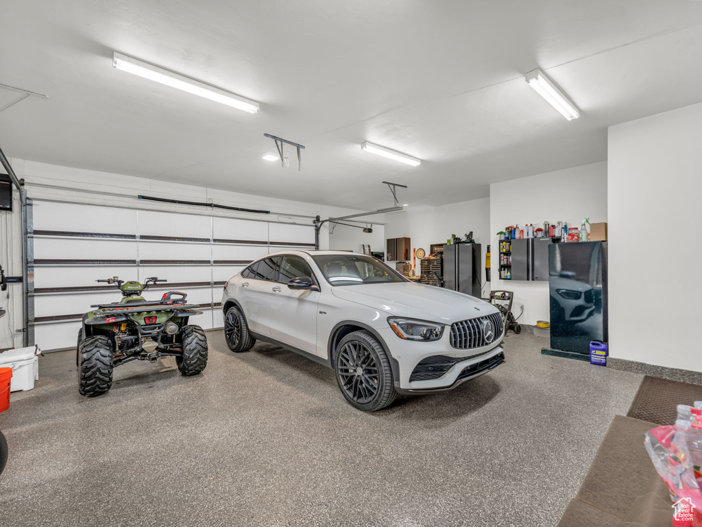 Garage with freestanding refrigerator