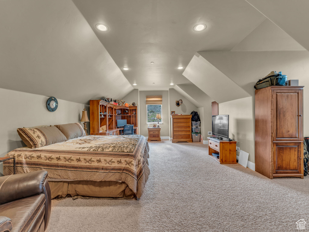 Carpeted bedroom with lofted ceiling, recessed lighting, and baseboards