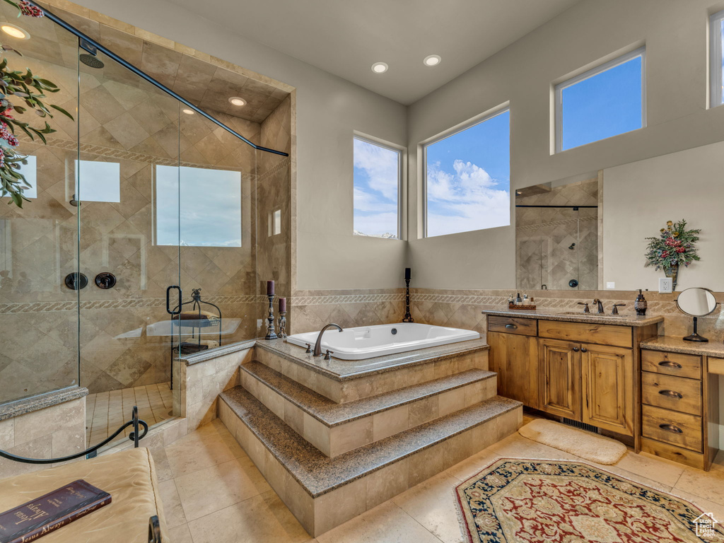 Full bathroom featuring a garden tub, a shower stall, vanity, recessed lighting, and tile patterned flooring