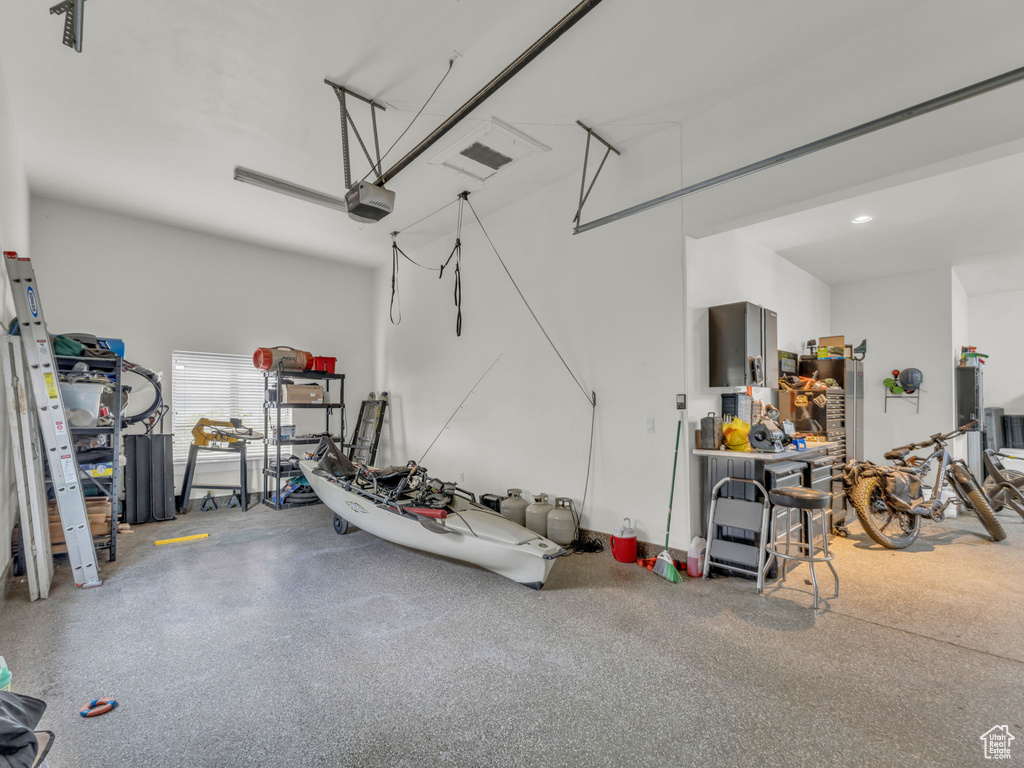 Garage featuring a garage door opener