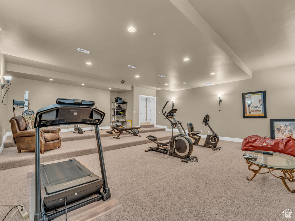 Exercise area with baseboards, recessed lighting, and carpet floors