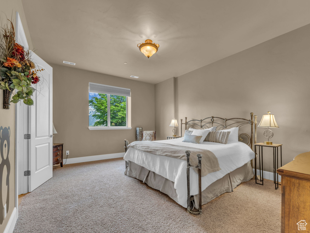 Bedroom with baseboards and carpet flooring